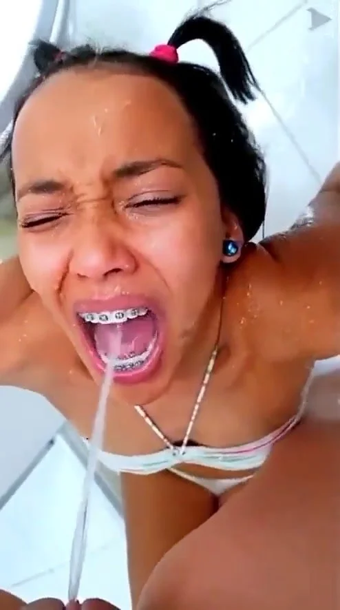 Cute Brazilian girl with braces takes anothers piss - ThisVid.com